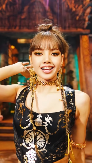 Lalisa Manoban in ornate gold jewelry and black top