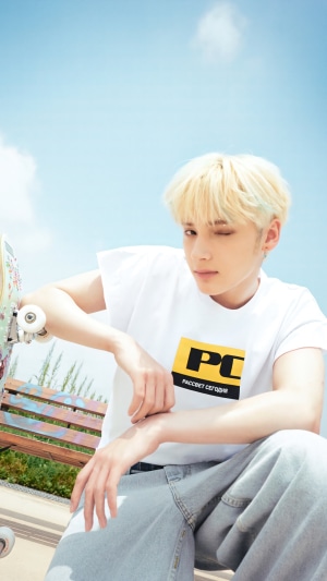 Huening Kai from TXT with a skateboard