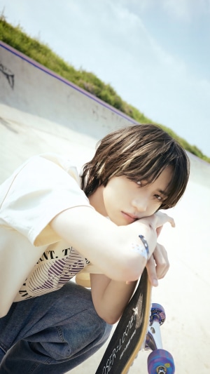 Beomgyu from TXT with a skateboard