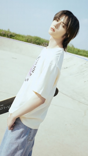 Beomgyu from TXT with a skateboard