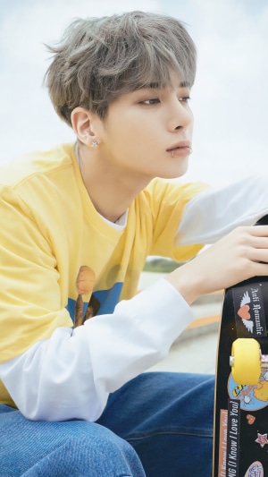 Taehyun from TXT with a skateboard