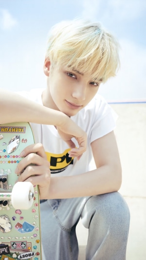 Huening Kai from TXT with a skateboard