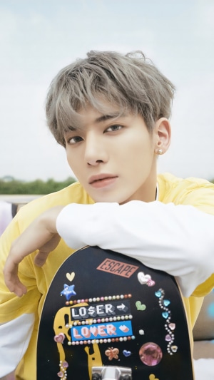 Kang Taehyun from TXT with skateboard