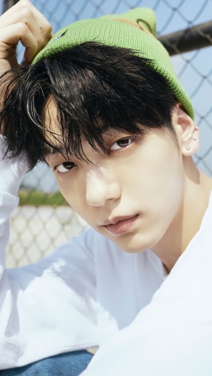 Soobin from TXT wearing a green beanie