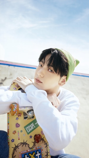 Soobin from TXT with a skateboard