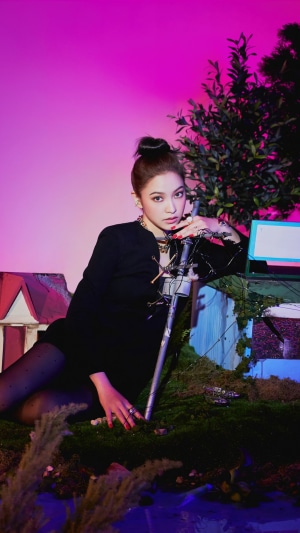 Yeri from Red Velvet posing with a prop