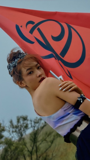 Yeri from Red Velvet holding a red flag