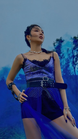 Joy from Red Velvet in a blue outfit