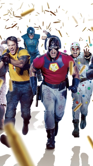 The Suicide Squad characters running with confetti
