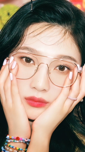 Joy from Red Velvet wearing glasses and bracelets