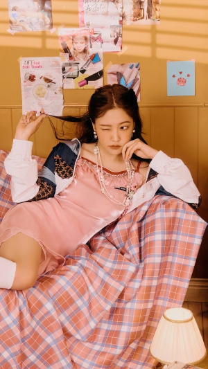 Yeri from Red Velvet posing on a bed