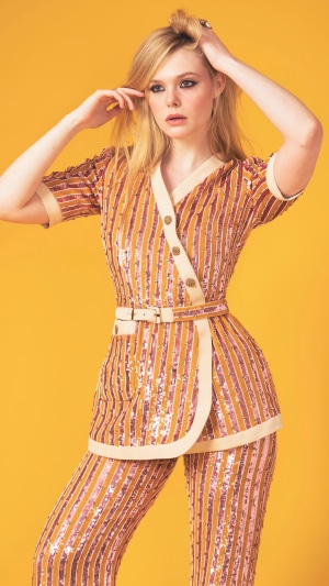 Elle Fanning in a sequined striped suit