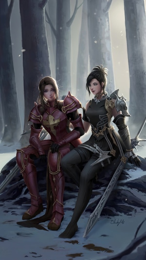 Two female warriors in armor in a snowy forest