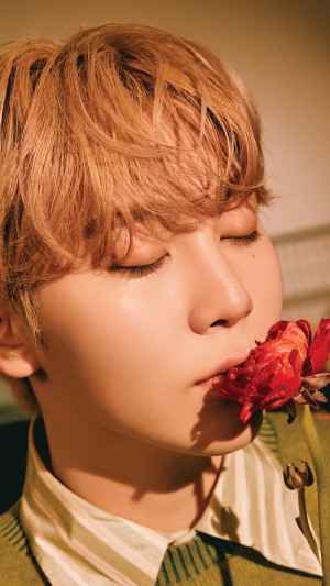 Seungkwan from Seventeen with a rose