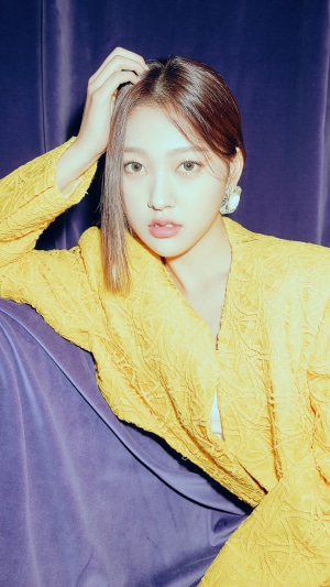 Choerry from Loona posing in a yellow jacket