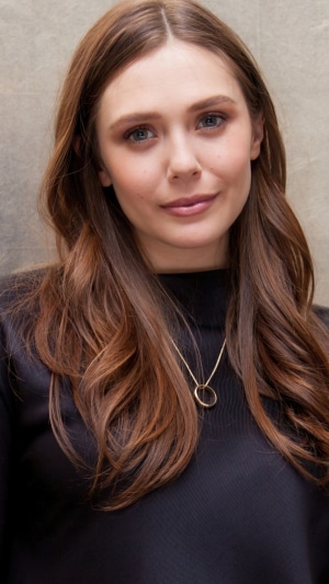 Elizabeth Olsen wearing a black top and necklace