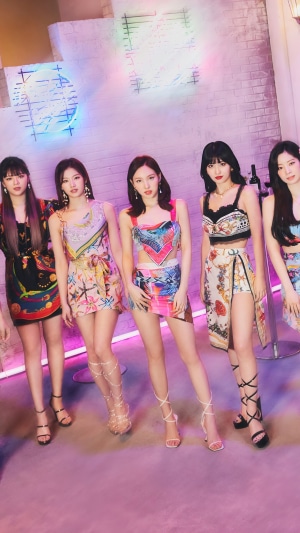 TWICE members in colorful outfits