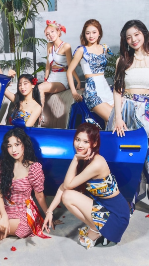 TWICE members posing in summer outfits