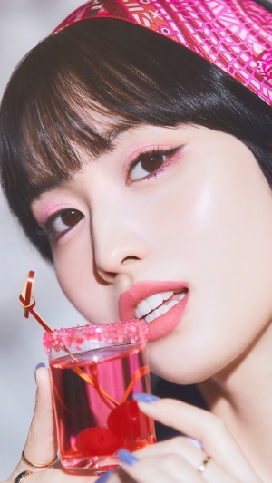 Momo from TWICE with a pink cocktail