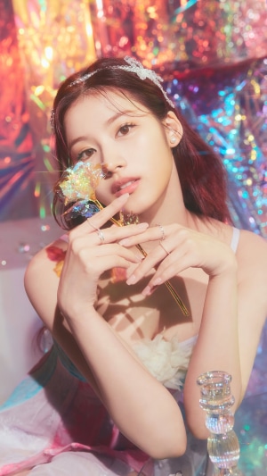 Sana from TWICE holding a flower