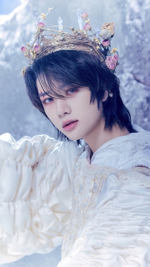 Beomgyu from TXT wearing a crown