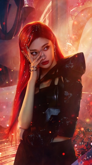Ningning from Aespa in black outfit with red hair