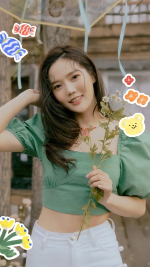 Hyojung from Oh My Girl holding a flower