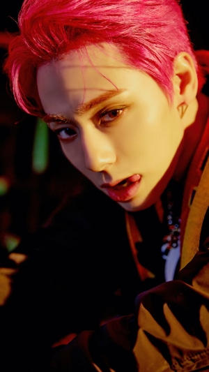 Hwanwoong from ONEUS with pink hair
