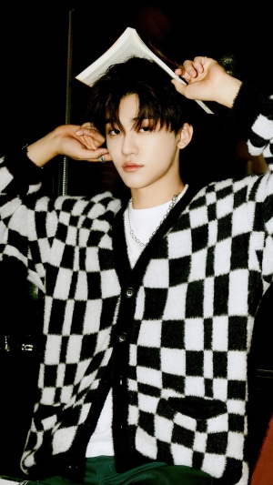 Jaemin from NCT Dream with a book