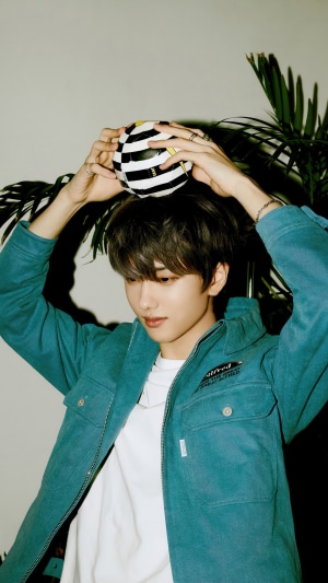 Jisung from NCT Dream holding a ball