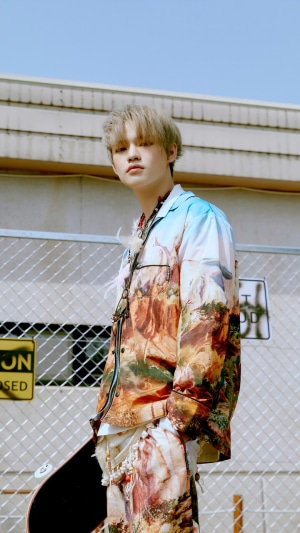 Chenle from NCT Dream with a skateboard
