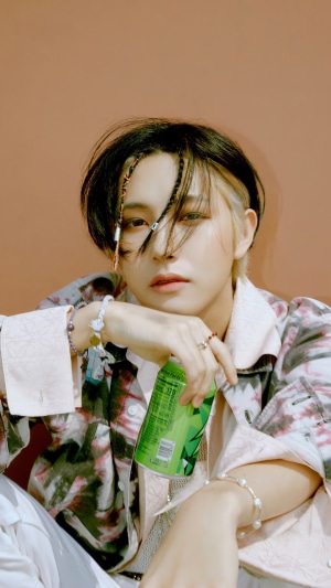 Renjun from NCT Dream holding a green can