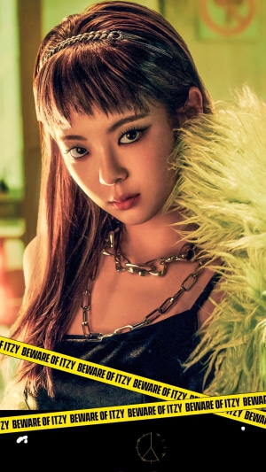Lia from ITZY with yellow caution tape