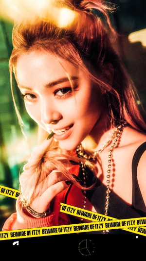 Ryujin from ITZY with yellow caution tape