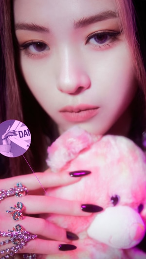Ryujin from ITZY with a pink teddy bear