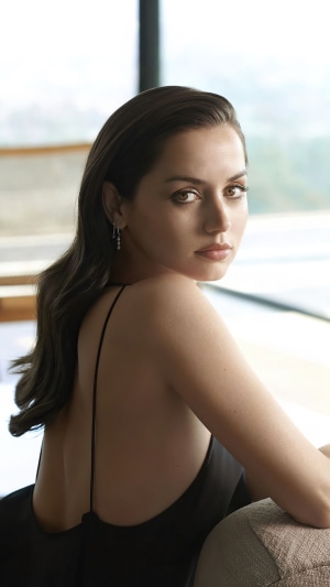 Ana de Armas posing in a black dress