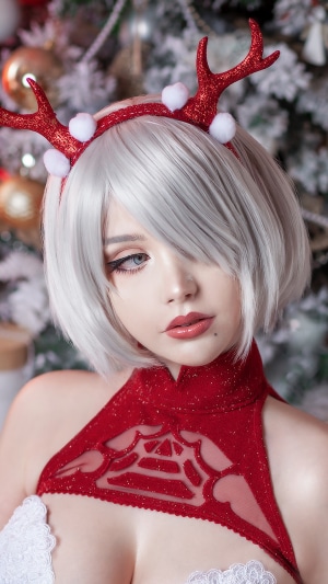 Woman in Christmas outfit with reindeer antlers