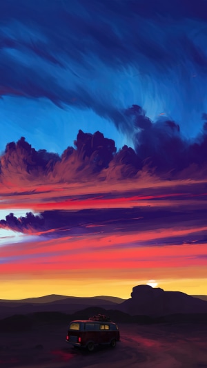 Van driving through desert landscape at sunset