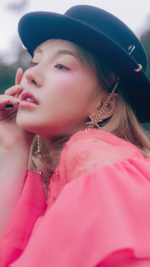 Wendy Son Seung Wan from Red Velvet wearing a hat and pink dress