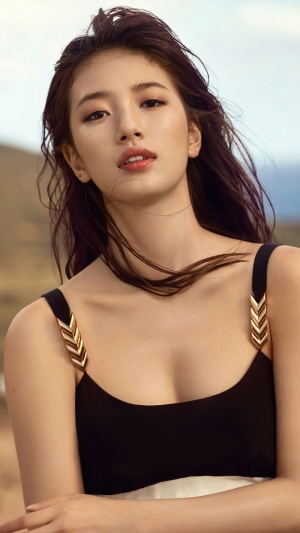 Bae Suzy in a black dress with gold accents