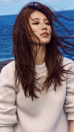 Bae Suzy in a cream sweater by the ocean