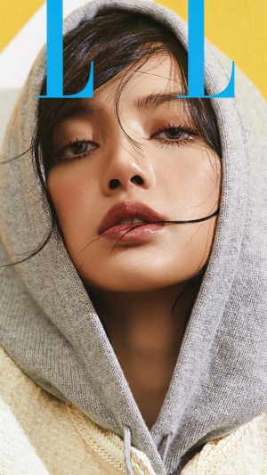 Lisa from BLACKPINK wearing a hoodie
