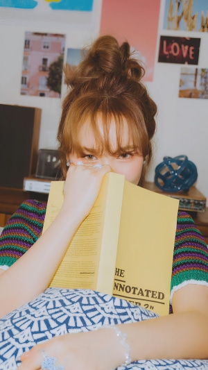 Wendy from Red Velvet holding a book
