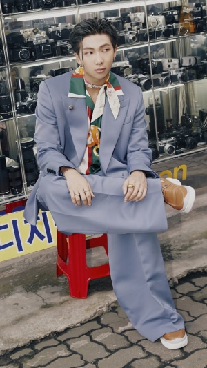 RM from BTS sitting in front of cameras