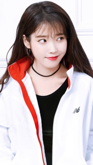 IU (Lee Ji Eun) wearing a New Balance jacket