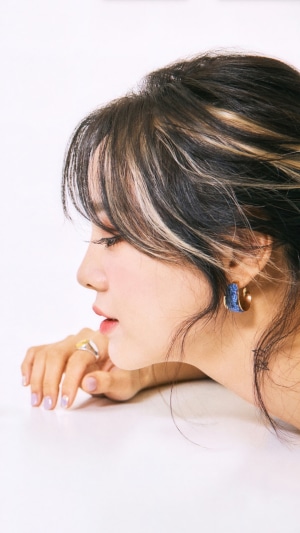 Kim Sejeong profile portrait with earrings and rings
