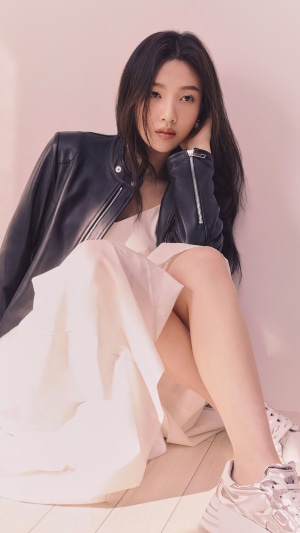 Joy from Red Velvet wearing a leather jacket and dress