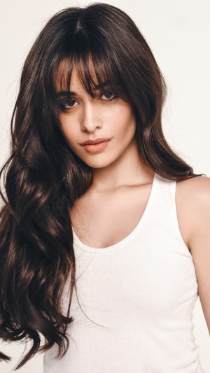 Camila Cabello in a white tank top