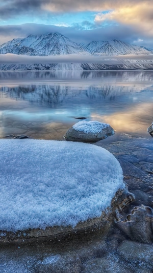 Snowy Mountains Reflected in a Calm Lake