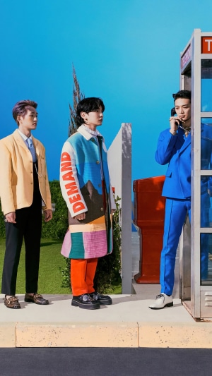 Shinee members Minho, Key, and Onew in colorful outfits